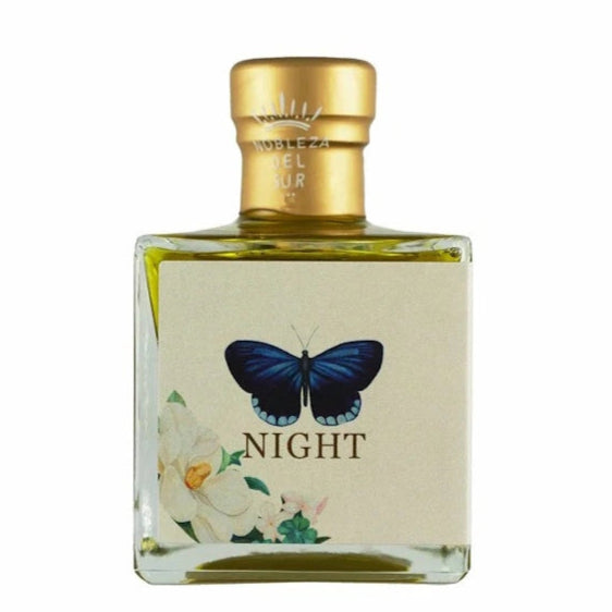 Bottle of 'NIGHT' with a butterfly design on a white background
