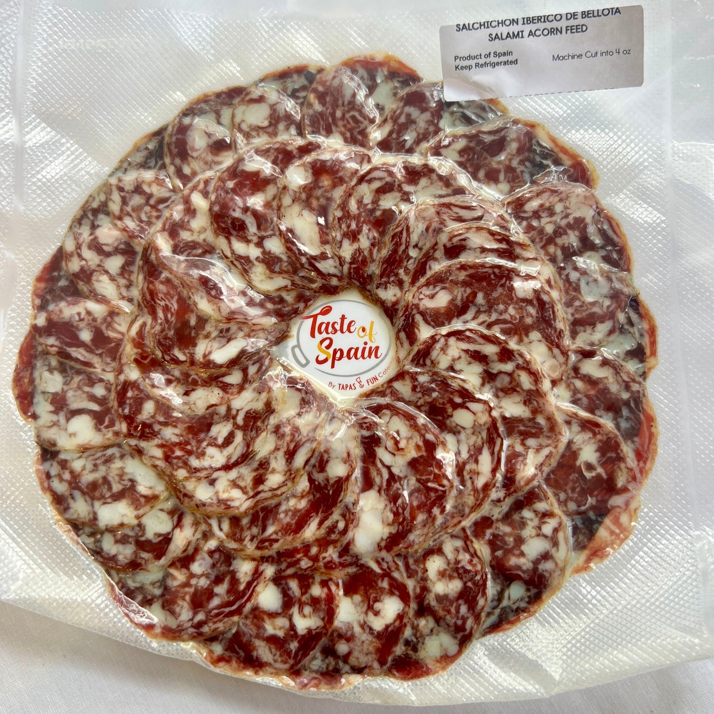 cured meat with 'Taste of Spain' branding on a white background.
